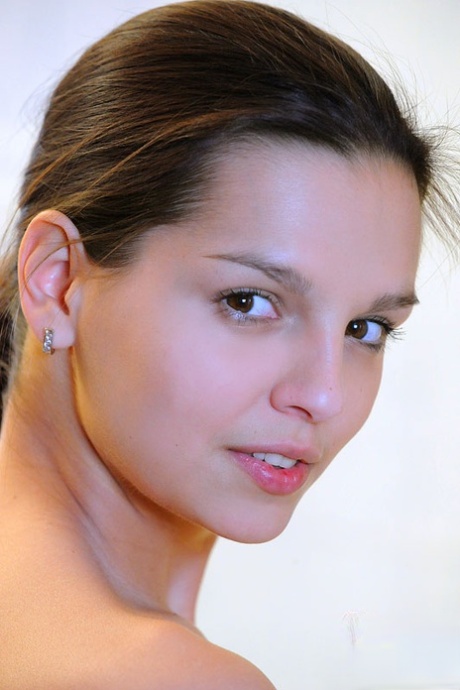 Fair skinned solo girl Eve Angel does her makeup after taking a bath