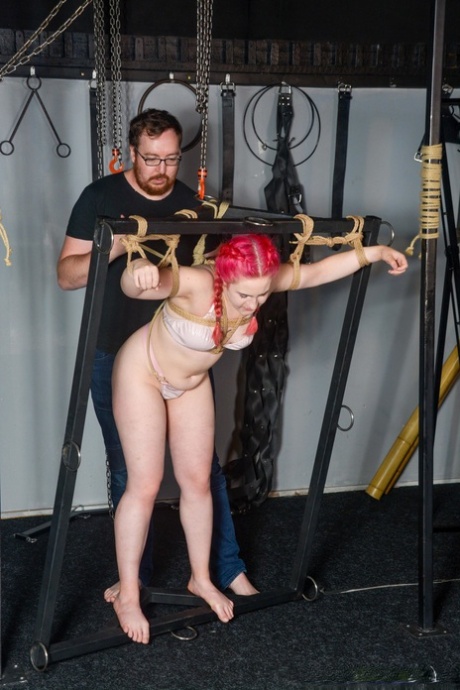Full-figured female sub in lingerie gets tied up in rope bondage